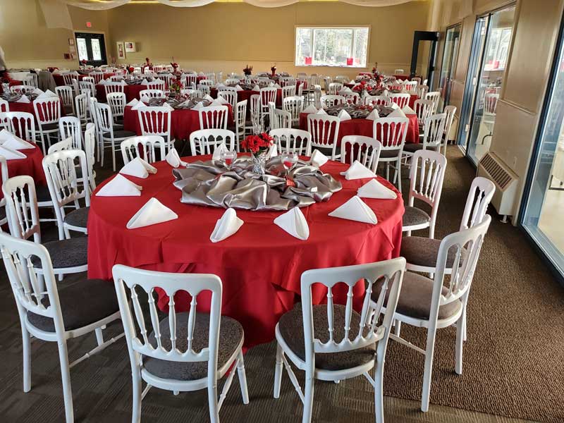 Round tables for 12.  Wooden chairs, many windows, room is light beige.